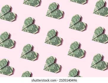 Origami Heart Dollar Plane Seamless Isometric Pattern On Pastel Pink Background. Business, Finance, Money Making Minimal Concept Wallpaper.