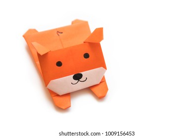 Origami for kids : dog with brown folded paper on white background isolated. Copy space for text.Selective focus.Easy to use for card.