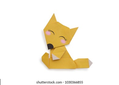 Origami for kids : Fox with yellow folded paper on white background isolated. Copy space for text.Top view, flat lay.Easy to use for card.