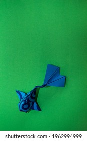 Origami Koi Fish On A Green Background