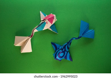 Origami Koi Fish On A Green Background