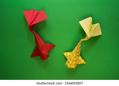 Origami Koi Fish On A Green Background