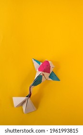 Origami Koi Fish On A Yellow Background