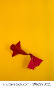 Origami Koi Fish On A Yellow Background