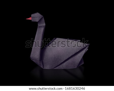 Origami paper rare event black swan on a black