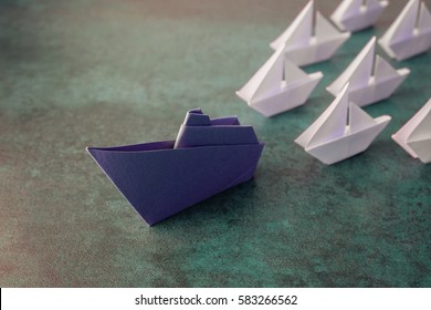 Origami paper ship boats, success leadership, strategy planning development, social media influence marketing, HR recruiter, disruptive innovation, breakthrough business model solutions concept - Shutterstock ID 583266562