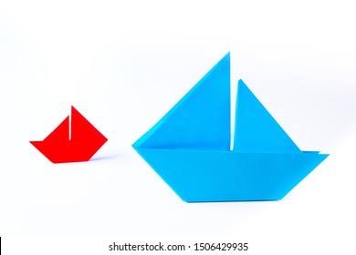 Origami. Two Paper Boats On A White Background. From Small Grows Large. Large And Small Business. Small Things Can Get Big. The Pursuit Of Success, Regardless Of Size.