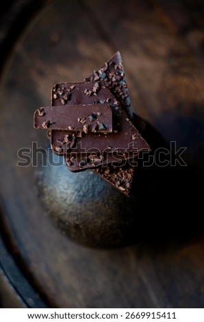 origin chocolate chunks, elevated by the addition of cacao nibs aged in a Venezuelan rum barrel. 