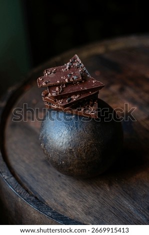 origin chocolate chunks, elevated by the addition of cacao nibs aged in a Venezuelan rum barrel. 