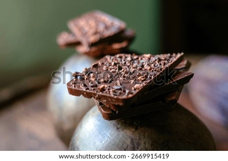 origin chocolate chunks, elevated by the addition of cacao nibs aged in a Venezuelan rum barrel. 