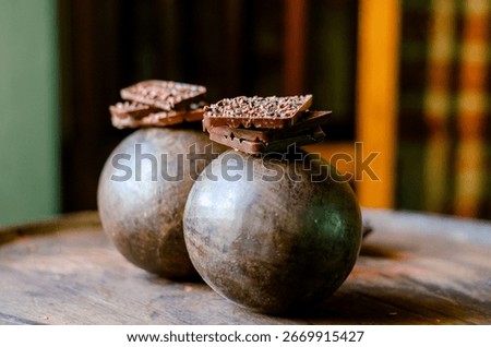 origin chocolate chunks, elevated by the addition of cacao nibs aged in a Venezuelan rum barrel. 
