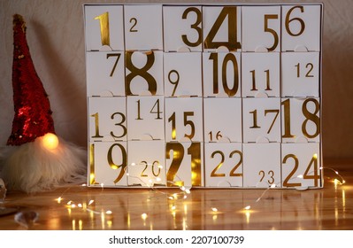 Original advent calendar with gold numbers from 1 to 24, New Year crafts, gift boxes for every day, magical moments, Christmas miracle in every home, gifts for Christmas, Soft focus, depth of field - Shutterstock ID 2207100739