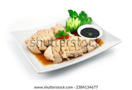Original Cantonese Chicken Singapore Style decorated with carved Cucumber Served black soy sauce sideview