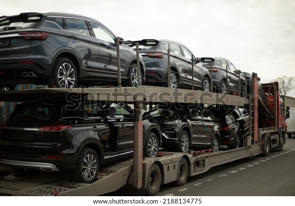 Original cars. Transporter with cars. Truck carries\
transport. Lots of\
cars.