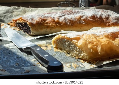 Original Hungarian homemade poppy seed and cottage cheese strudel on an oven tray