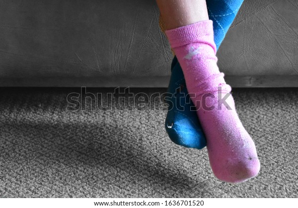 original\
and nonconformist child with mismatched\
socks