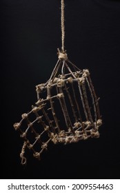 Original Open Cage Of Twigs On A Black Background