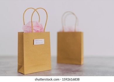 original product vs dupe imitation conceptual still-life, shopping bags with labels side by side with similar paper color symbol of cheap product alternatives  - Shutterstock ID 1592616838