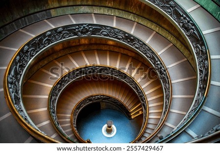 The original Staircase, with its iconic spiraling structure featuring herringbone paving, was built in 1505, while the modern one, was built in 1932 in Vatican City, Italy, 