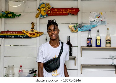 Orika Isla, Cartagena, Bolívar- Colombia; 01-03- 
2021: Young man modeling in front of the camera on a break from his bartending job.