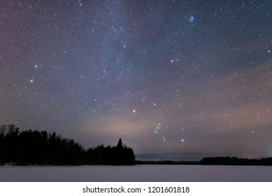 Orion constellation above frozen lake