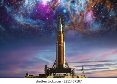 Orion spacecraft on launchpad on nebula background. Mission to the Moon. Artemis space program to research solar system. Elements of this image furnished by NASA. 