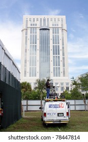 ORLANDO, FL - JUNE 1: A Local TV News Crew Person In Front Of The Orange County Courthouse, Covering The Much-publicized Trial Of Casey Anthony In Orlando, FL, June 1, 2011.