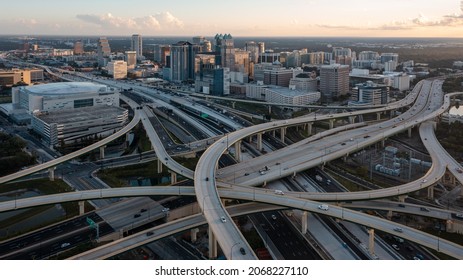 "Orlando, FL USA - 10-15-2021: Aerial shot at dusk over the 408 and I-4 interchange in Orlando."