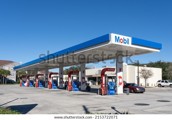 Orlando, Fl, USA -\
January 3, 2022: A Mobil gas station is shown in Orlando, Fl, USA.\
Mobil Corporation was an American oil company that merged with\
Exxon in 1999 to form\
ExxonMobil.