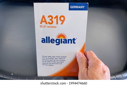 Orlando, FL USA- May 13, 2021 :  An Allegiant Airplane  Brochure Containing Safety Information About The Airplane That Is Found In The Seat Back Pocket.