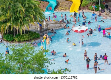 Orlando, Florida. April 07, 2019. Parent And Kids Enjoying Water Play Areas At Aquatica Water Park  .