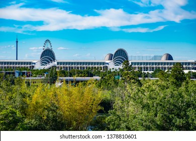 Orlando, Florida. April 20, 2019.  Panoramic view of Orlando Convention Center and green forest background on lightblue sky cloudy background at Seaworld in International Drive area (1)