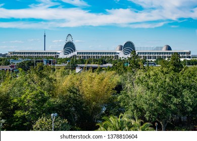 Orlando, Florida. April 20, 2019.  Panoramic view of Orlando Convention Center and green forest background on lightblue sky cloudy background(2)