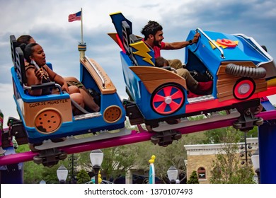 Orlando, Florida. April 7, 2019.  People Enjoying Cookie Drop Rollercoaster Family Friendly Attraction At Seaworld In International Drive Area (1)