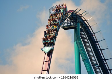 Orlando, Florida; August 25, 2018 Young People Having Fun On Rollercoaster.