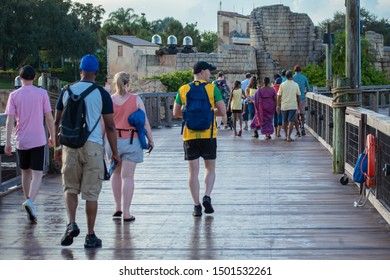 Orlando, Florida. August 31, 2019. People Walking On Seven Seas Lagoon Bridge At Seaworld 1