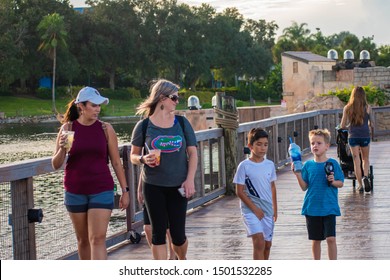 Orlando, Florida. August 31, 2019. People Walking On Seven Seas Lagoon Bridge At Seaworld 3