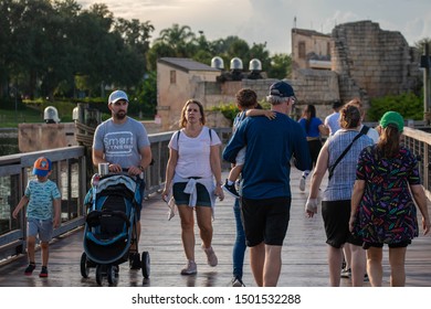 Orlando, Florida. August 31, 2019. People Walking On Seven Seas Lagoon Bridge At Seaworld 4