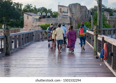 Orlando, Florida. August 31, 2019. People Walking On Seven Seas Lagoon Bridge At Seaworld 5