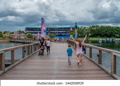 Orlando, Florida. June 17, 2019. Nice Girl Raising Her Arms While Walking With Her Family At Seaworld 