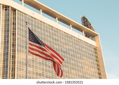 ORLANDO, FLORIDA - NOV 11, 2019: Advent Health Hospital Main Building With An American Flag.