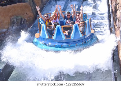 Orlando, Florida. October 19, 2018 Funny People Raising Hands, Having Fun Infinity Falls At Seaworld Theme Park.