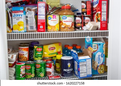 Orlando, Florida, United States - 01-12-2020: A view of a home pantry filled with an assortment of food products.