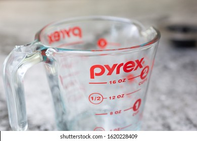 Orlando, Florida, United States - 01-12-2020: A closeup view of a Pyrex measurement cup glass on the kitchen counter.