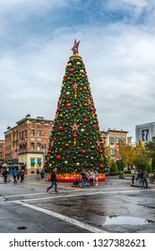 ORLANDO, FLORIDA, USA - DECEMBER, 2018: Christmas At Universal Studios Theme Park. Colorful Ornaments And Christmas Tree.