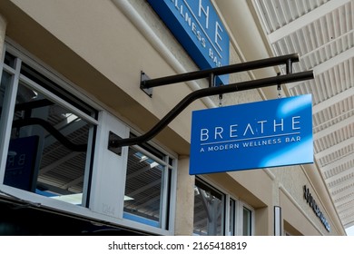 Orlando, Florida, USA - January 20, 2022:  Close up of Breathe Modern Wellness Bar hanging sign is shown. Breathe inc is an American oxygen bar company.