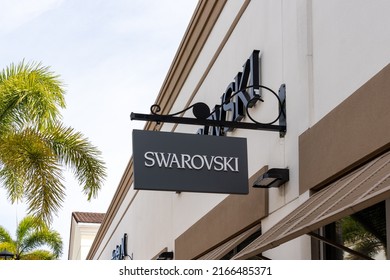 Orlando, Florida, USA- January 21, 2022: Swarovski store hanging sign in Orlando, Florida, USA. Swarovski is an Austrian producer of crystal headquartered in Wattens, Austria.
