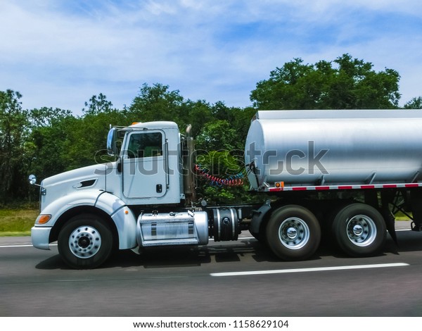 Orlando, Florida,\
USA - May 10, 2018: American style truck on freeway road at\
Orlando, Florida, USA on May 10\
2018