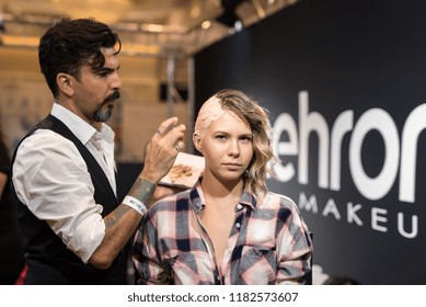 Orlando, Florida / USA - September 15, 2018: Special Effects Makeup Artist With A Female Model At The Makeup Show In Orlando, FL