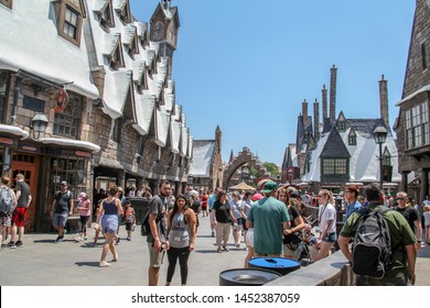 Orlando, Florida, USA, September 6, 2019: Hogsmeade, Diagon Alley, Snow-covered Architecture Filled With Harry Potter Movie And Book Stores. People Food Court, Trade. Convenience